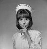 Young nurse with finger on lips Poster Print - Item # VARSAL255418026
