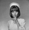 Young nurse with finger on lips Poster Print - Item # VARSAL255418026