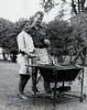 Young couple cooking sausages on a barbecue grill Poster Print - Item # VARSAL255350