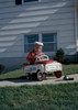 Boy playing with toy car in back yard Poster Print - Item # VARSAL255422651