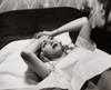 Close-up of a young woman lying on the bed holding her head Poster Print - Item # VARSAL25527697