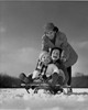 Mother pushing her children on a sled Poster Print - Item # VARSAL2554031