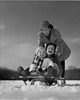 Mother pushing her children on a sled Poster Print - Item # VARSAL2554031