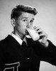 Portrait of a young man drinking milk Poster Print - Item # VARSAL25512689
