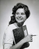 Close-up of a teenage girl holding a composition book and a pencil Poster Print - Item # VARSAL25512559