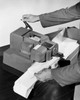 Man's hands operating a postage stamp machine Poster Print - Item # VARSAL25532624
