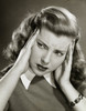 Close-up of a young woman holding her head Poster Print - Item # VARSAL2552897