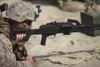 U.S. Marine prepares to fire a PK 7.62mm general-purpose machine gun in a wadi near Kunduz, Afghanistan Poster Print - Item # VARPSTTMO100363M