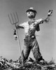 Low angle view of a scarecrow with a pitchfork Poster Print - Item # VARSAL2554254