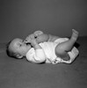 Baby girl lying on back  sucking toes Poster Print - Item # VARSAL255630