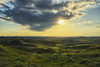 The sun shines through a cloud over the Killdeer Badlands, Grasslands National Park; Saskatchewan, Canada PosterPrint - Item # VARDPI12252437