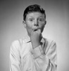 Portrait of freckled boy holding hand in mouth Poster Print - Item # VARSAL255416817