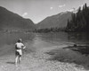Rear view of a woman fly-fishing in a lake  Baker Lake  Mount Baker-Snoqualmie National Forest  Washington  USA Poster Print - Item # VARSAL25520998