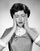 Close-up of a young woman suffering from a headache Poster Print - Item # VARSAL25534814