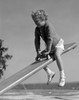 Girl on seesaw in playground Poster Print - Item # VARSAL25514181