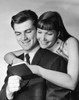 Close-up of a young couple reading a bankbook and smiling Poster Print - Item # VARSAL25519162A