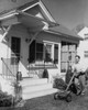 Young man mowing a front lawn Poster Print - Item # VARSAL25532738