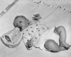 High angle view of a baby lying on a blanket and drinking milk from a bottle Poster Print - Item # VARSAL2559662