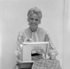 Portrait of woman at sewing machine Poster Print - Item # VARSAL25541765