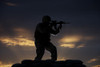 Partially silhouetted U.S. Marine on a bunker in Northern Afghanistan Poster Print - Item # VARPSTTMO100557M