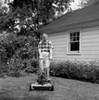 Senior man mowing grass in backyard Poster Print - Item # VARSAL255417542