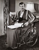 Portrait of a mature man sitting on a wheel chair smiling about a check Poster Print - Item # VARSAL2553531