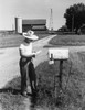 Side profile of a man reading mail in front of a mailbox  Randolph  Wisconsin  USA Poster Print - Item # VARSAL25520147