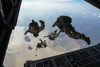 November 15, 2013 - U.S. Pararescuemen and U.S. Marines jump from a U.S. Air Force HC-130 near Camp Lemonnier, Djibouti Poster Print - Item # VARPSTSTK108780M