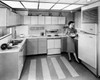 Young woman working in a kitchen Poster Print - Item # VARSAL25528988