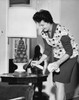 Close-up of a mid adult woman cleaning a coffee table Poster Print - Item # VARSAL25519081