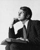 Young man looking serious with a book on his lap Poster Print - Item # VARSAL25517557