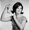 Young woman using hairspray Poster Print - Item # VARSAL255417832