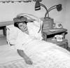 Mature woman reclining in bed with headache Poster Print - Item # VARSAL255417720