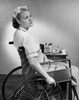 Side profile of a mid adult woman sitting on a wheelchair Poster Print - Item # VARSAL25518695