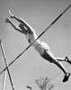 Low angle view of a young man pole vaulting Poster Print - Item # VARSAL25518586C
