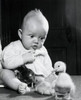 Close-up of a baby boy playing with three baby chicks Poster Print - Item # VARSAL2555015