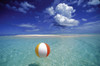 French Polynesia, Bora Bora, Calm Ocean With Beach Ball Foreground Patch Of Sand Background Blue Sky Clouds PosterPrint - Item # VARDPI2001089