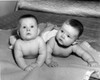 two babies lying on bed Poster Print