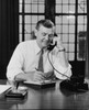 Businessman talking on the telephone in an office Poster Print - Item # VARSAL25514966