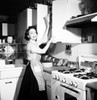 Portrait of a young woman working in a kitchen Poster Print - Item # VARSAL25538371