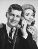 Young couple listening on the telephone Poster Print - Item # VARSAL25544515