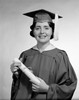 Woman wearing graduation gown holding diploma Poster Print - Item # VARSAL255416274
