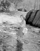 Young woman fishing in stream Poster Print - Item # VARSAL255419299