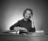 Woman sitting at desk reading book Poster Print - Item # VARSAL25528040B