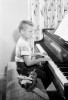 Side profile of boy playing piano Poster Print - Item # VARSAL25513164