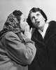 Side profile of a young woman whispering to another young woman Poster Print - Item # VARSAL25527259