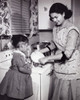 Mother and her daughter washing kitchen utensils Poster Print - Item # VARSAL25518641