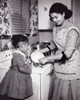 Mother and her daughter washing kitchen utensils Poster Print - Item # VARSAL25518641
