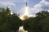 Space Shuttle Atlantis lifts off from its launch pad toward Earth orbit Poster Print