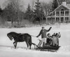 Mature couple with their children riding in a horsedrawn sleigh and waving their hands Poster Print - Item # VARSAL25517130